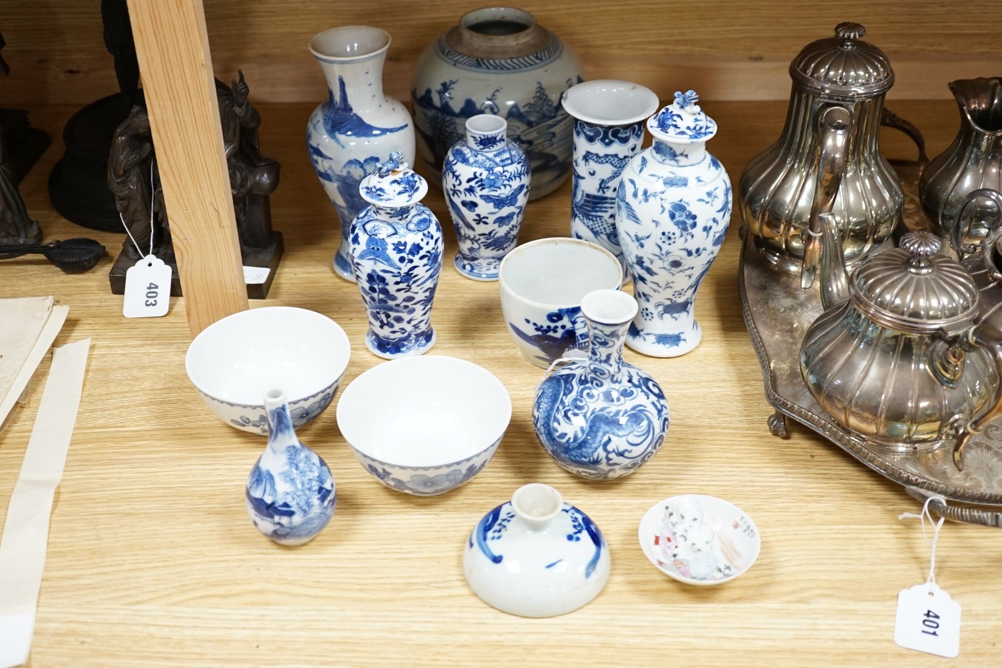 Twelve pieces of 19th century Chinese blue and white tableware and a small famille rose bowl, largest 20cm